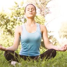 Woman meditating outdoors