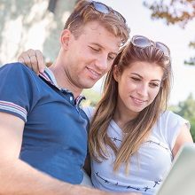 Man and woman looking at laptop