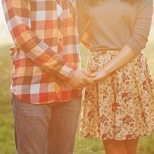 couple holding hands and hugging each other