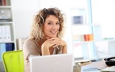 mature woman in the office with laptop