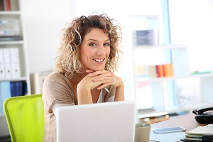 Woman in the office with laptop