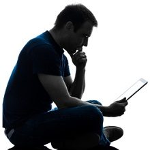 man reading tablet