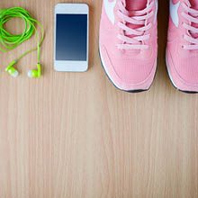 Headphones, phone and running shoes