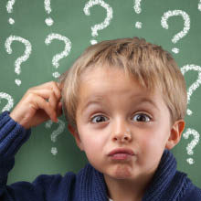 Child with question marks around his head