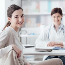 Woman sitting with fertility specialist