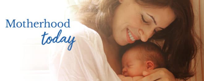 motherhood and baby embracing
