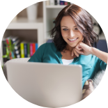 Beautiful happy burnette woman with computer feature image landing page