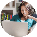 Beautiful happy burnette woman with computer feature image landing page